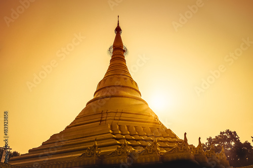 Canvas Print magical sunset golden with a buddhist stupa in nepal.