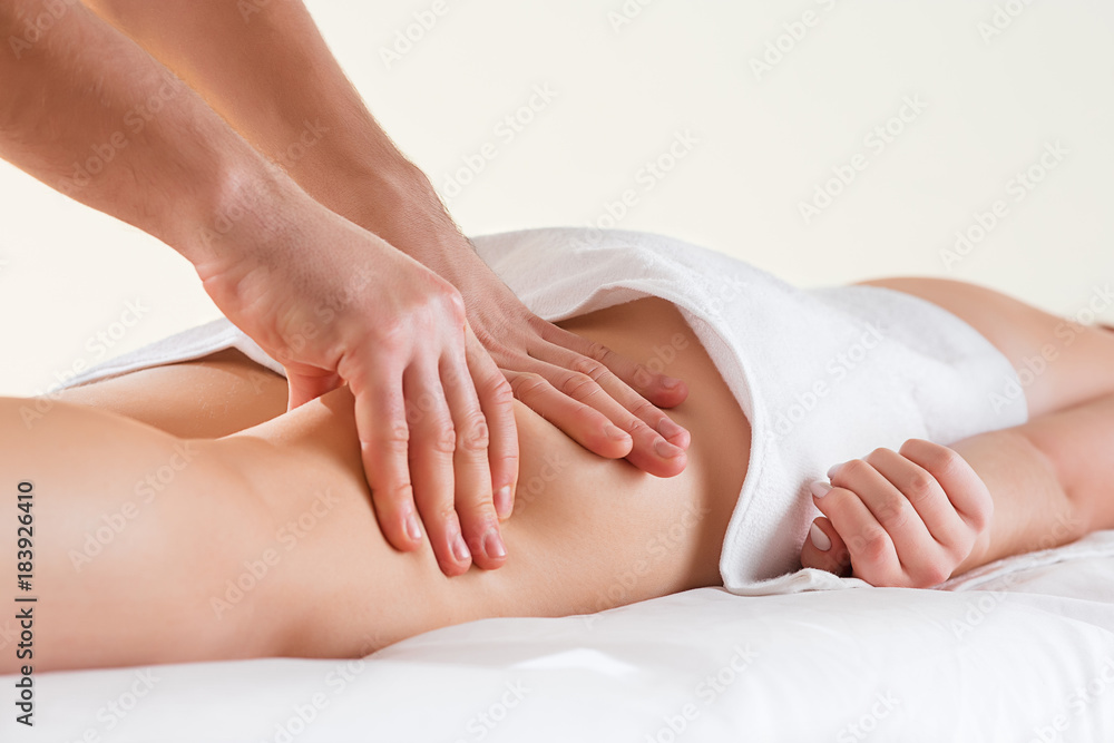 Detail of hands massaging human calf muscle. Detail of hands massaging human calf muscle.