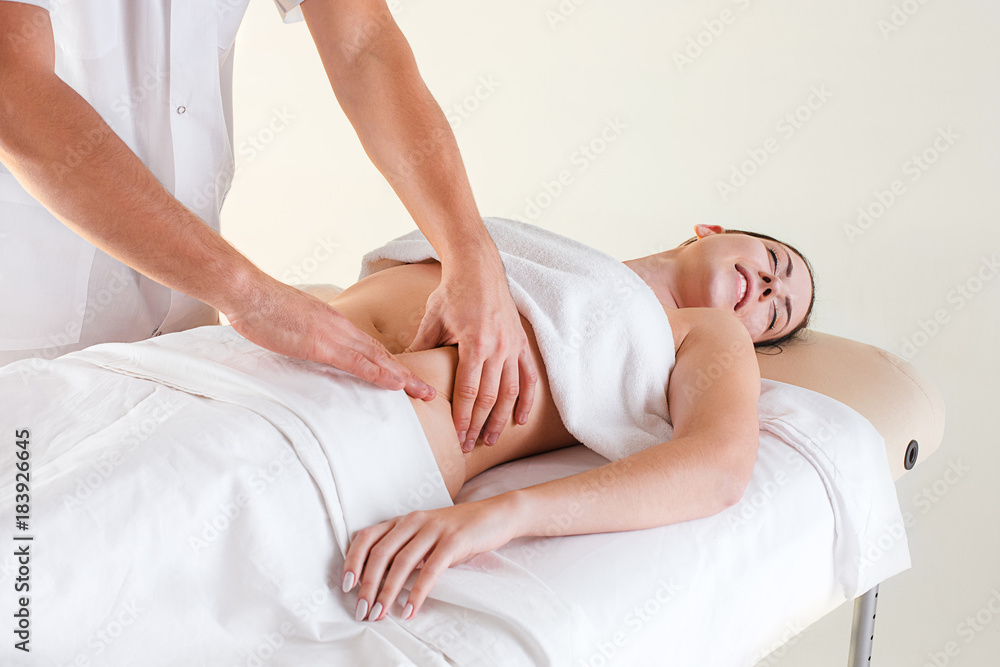 The picture of beautiful woman in massage salon