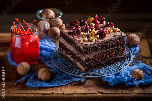 Sweet chocolate cake with cherry and nuts