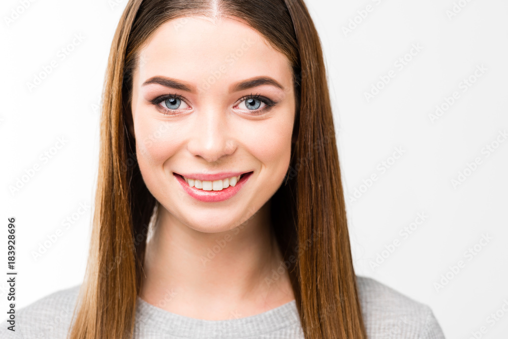 head and shoulders shot of beautiful smiling woman with straight hair looking at camera isolated on white head and shoulders shot of beautiful smiling woman with straight hair looking at camera isolated on white
