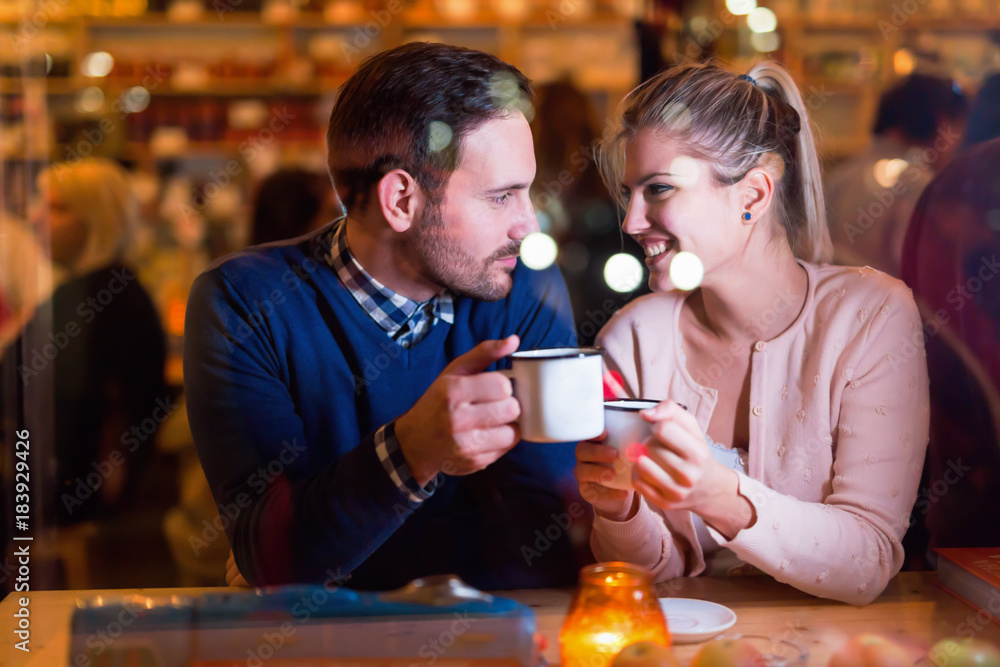 Young attractive couple on date in bar