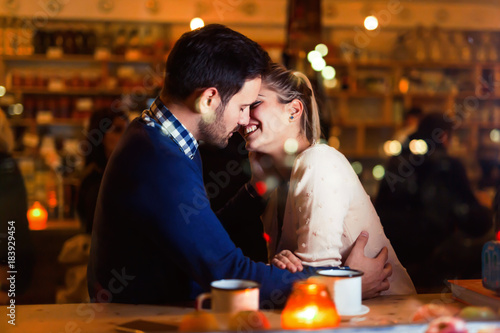Young attractive couple on date in bar
