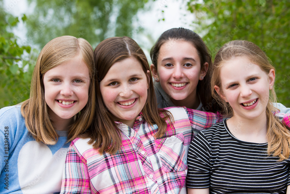 Obraz premium Portrait Of Young Girls Having Fun In Park Together