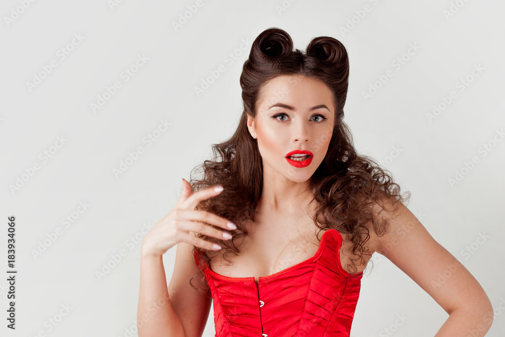 Charming lady in red corset, pin-up hairstyle Charming lady in red corset, pin-up hairstyle