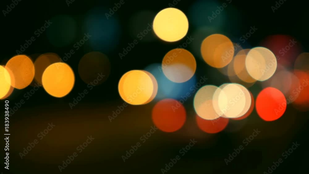 Defocused lights Los Angeles street abstract . City blur background. Moving bokeh circles of night traffic.