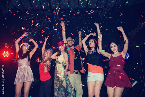 People in Party - Group of Friends Enjoy Throwing Confetti and Dancing in Nightclub
