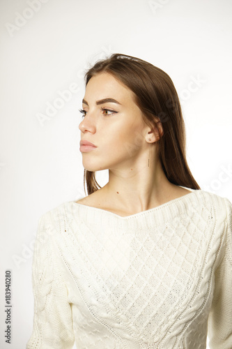 girl in white sweater on white background