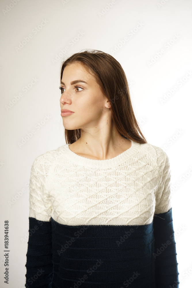 beautiful girl in a bright sweater on a white background beautiful girl in a bright sweater on a white background