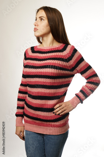 woman in a striped sweater on a white background