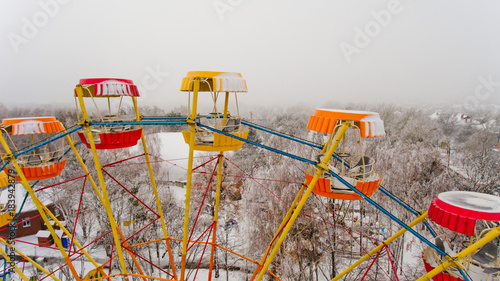 Ferris wheel in the central park of the city in winter. Aerial view. photo