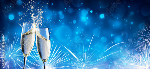 Toast With Champagne And Fireworks In Shiny Night
