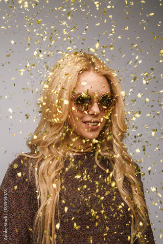 Bright blonde in golden confetti © danilkorolev