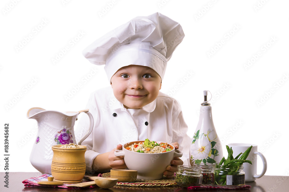 funny boy chef prepares porridge with vegetables funny boy chef prepares porridge with vegetables