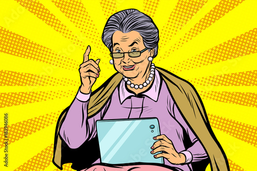 Caucasian elderly woman with a tablet