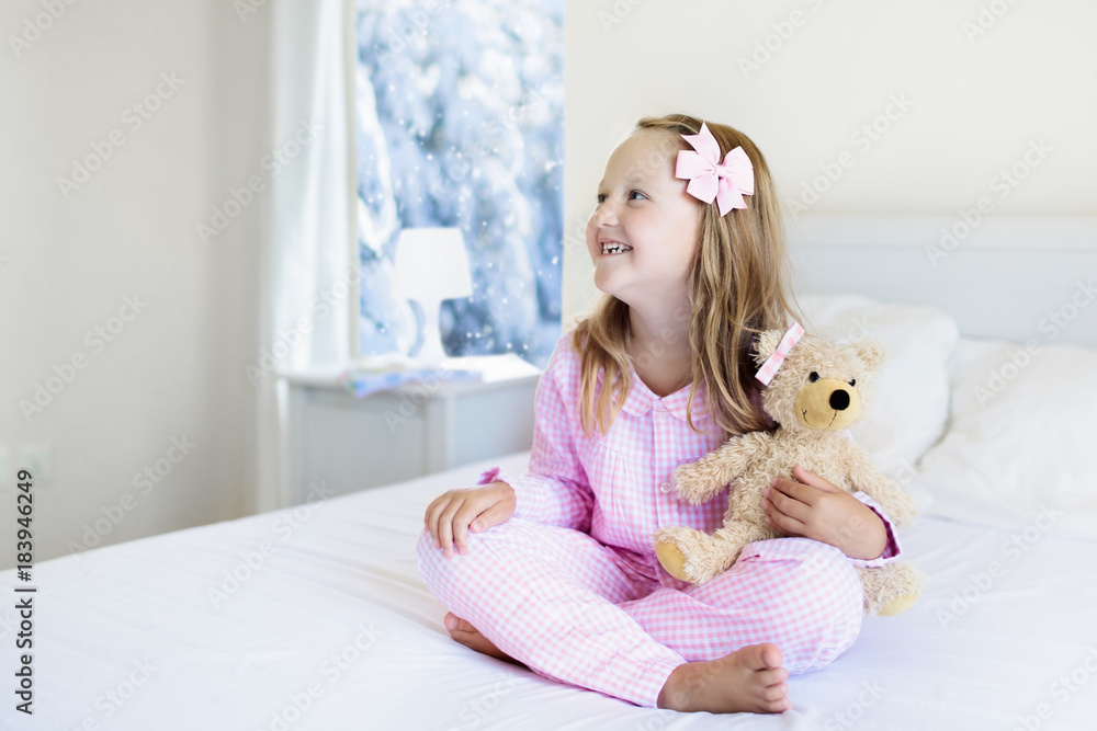 Kid in bed. Winter window. Child at home by snow. Kid in bed. Winter window. Child at home by snow.