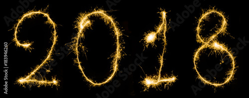 close up view of sparkling 2018 year sign isolated on black