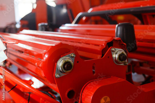 Close up of pipe system of hydraulic valves in agricultural machinery