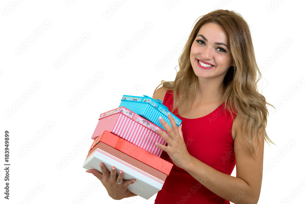 Portrait of a smiling pretty girl holding stack of gift boxes isolated over white background Portrait of a smiling pretty girl holding stack of gift boxes isolated over white background