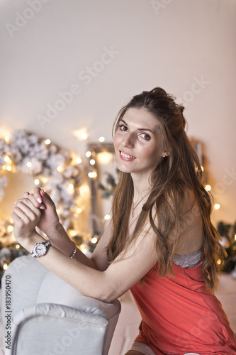 The girl with her long hair in Christmas decorations 9437.