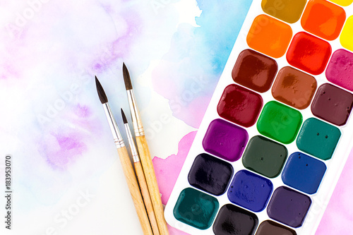 Palette of watercolor paints and brushes