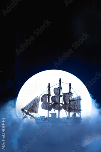 Photo Sail ship in light of full moon