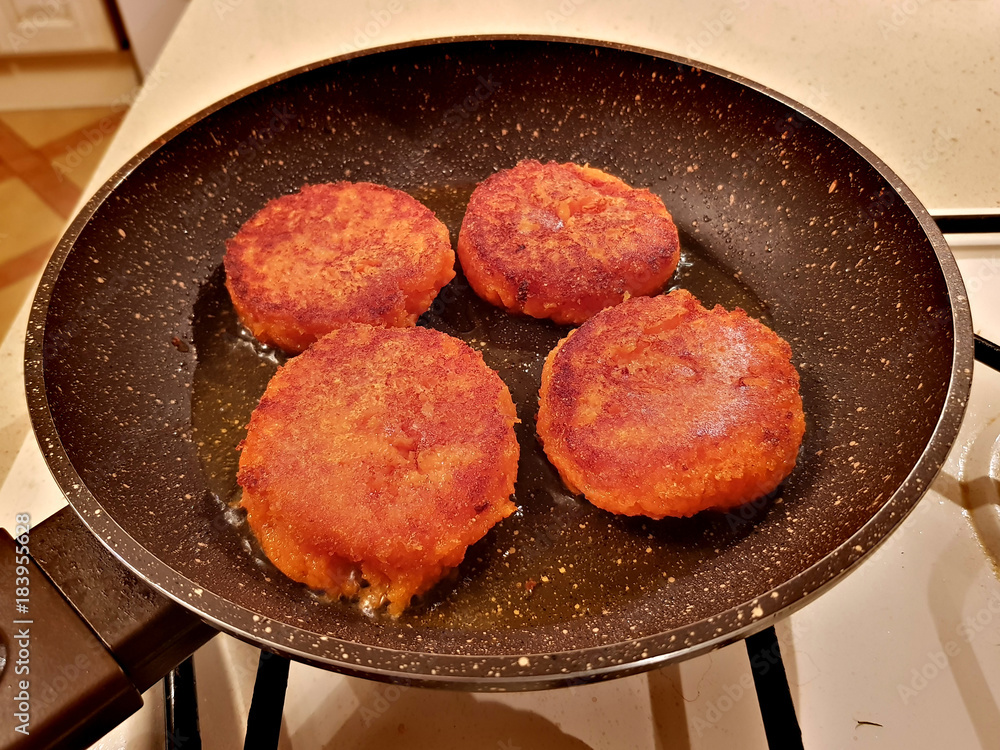 Juicy appetizing cutlets from carrots are fried in oil in a frying pan
Juicy appetizing cutlets from carrots are fried in oil in a frying pan