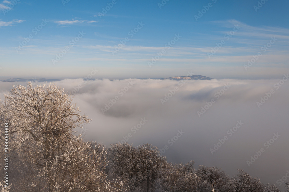 misty frosty snow winter landscape in nature, mist flowing, foggy winter landscape from Julianus tower 