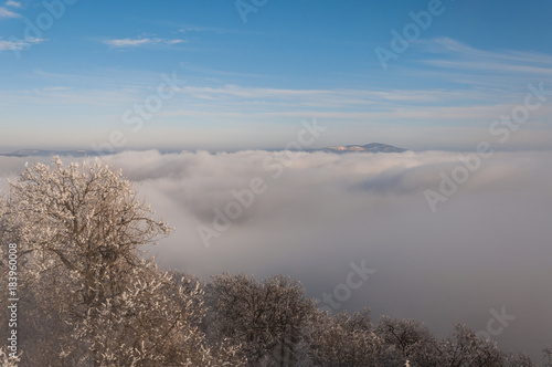 misty frosty snow winter landscape in nature, mist flowing, foggy winter landscape from Julianus tower 