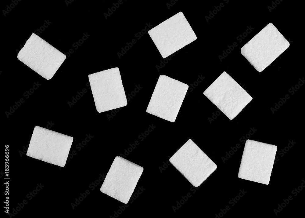 White sugar cubes isolated on black background and texture White sugar cubes isolated on black background and texture