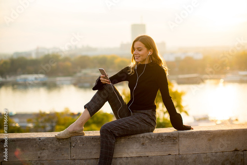 Young woman listening music...