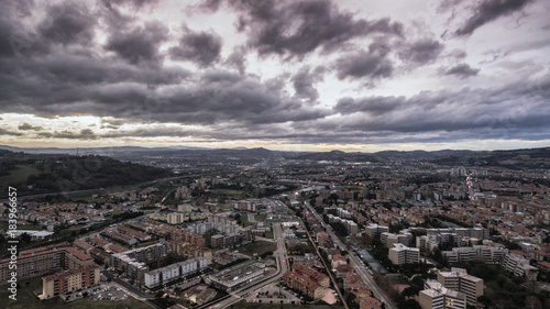 Italia, Pesaro dicembre 2017 - vista aerea della città con cielo minaccioso di tempesta © cristian