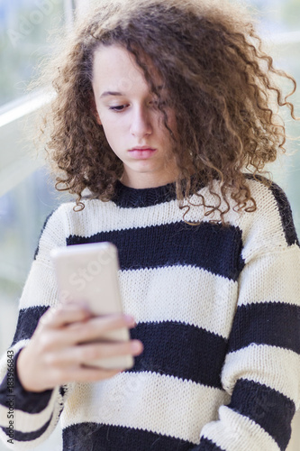 Curly hair teen girl with m...