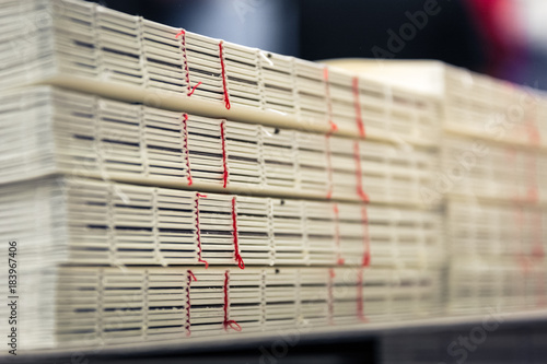 Fototapet Book Binding Thread Red Spines Stacks Industrial Production Finishing