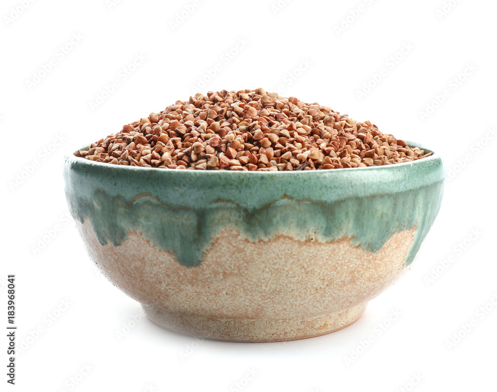 Bowl with raw buckwheat on white background Bowl with raw buckwheat on white background