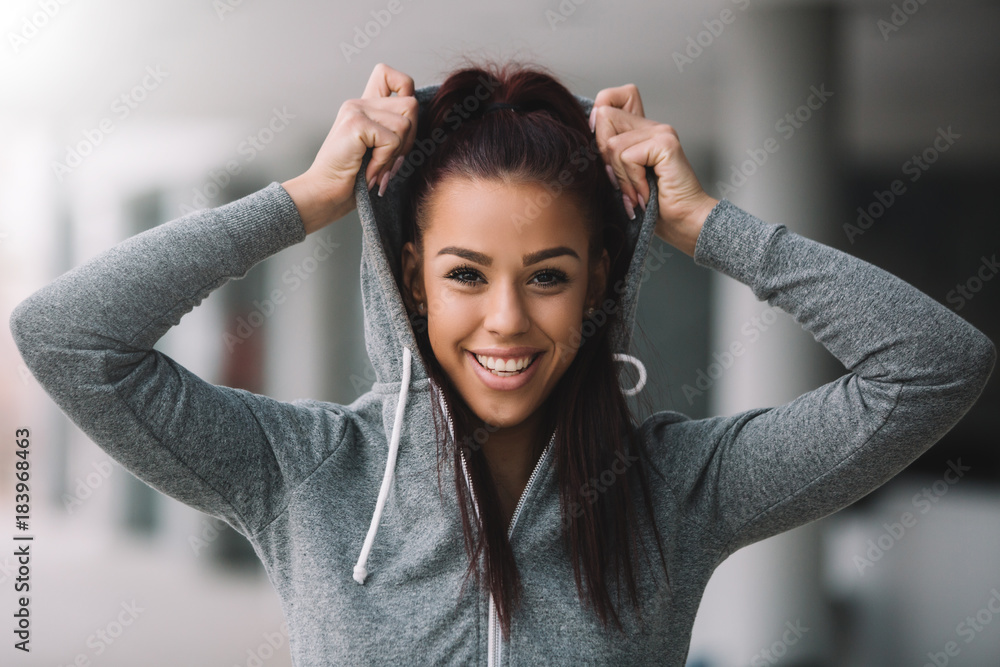 Close-up of an attractive young girl preparing for workout. Close-up of an attractive young girl preparing for workout.