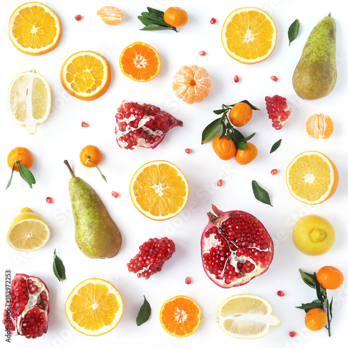 Fototapeta Naklejka Na Ścianę i Meble -  Composition from orange, pomegranate, mandarins with leaves isolated on white background. Food pattern of fruits. Creative flat layout of fruit slices, top view.