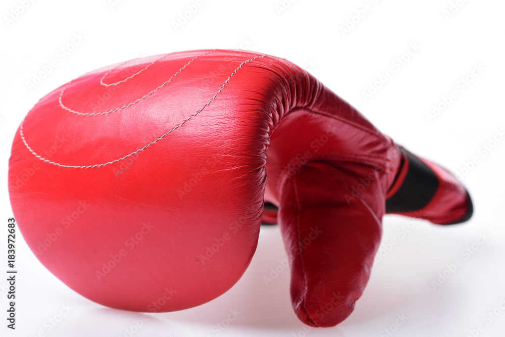 Protection and strength concept. Boxing glove in red color