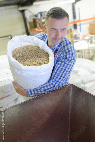 man with seeds in a factory
