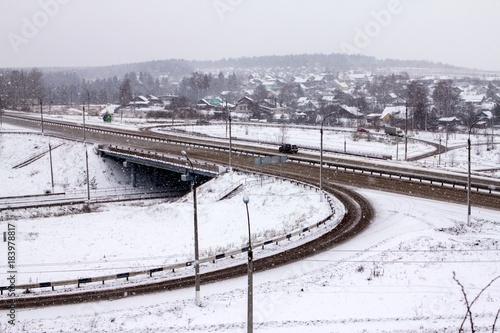 traffic junction during a snowfall on a winter day