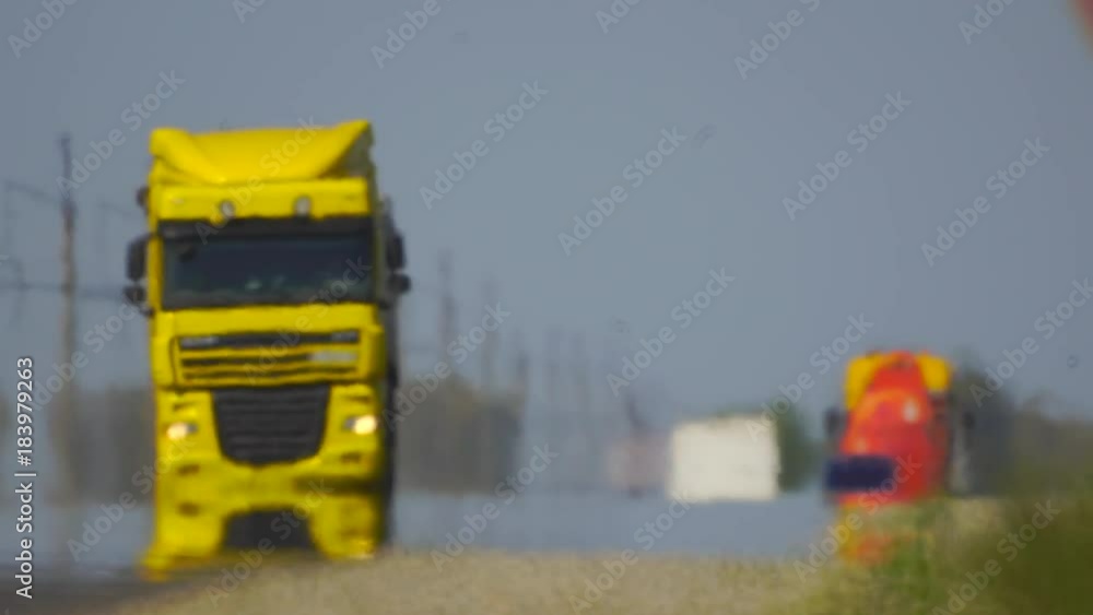 Track. The movement of vehicle on a road. Car traffic. Highway in summer day. Cars on a country road. Cars moving in two directions on highway. 4 k Track. The movement of vehicle on a road. Car traffic. Highway in summer day. Cars on a country road. Cars moving in two directions on highway. 4 k