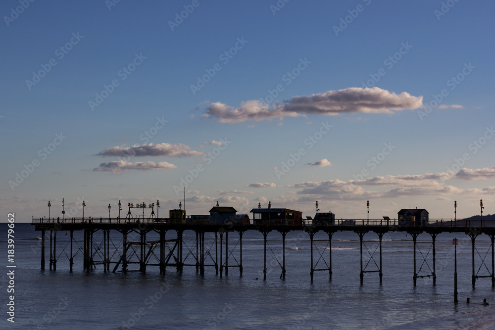 Silhouette of the Grand Pier in Teignmouth, Devon, England taken against a blue sky Silhouette of the Grand Pier in Teignmouth, Devon, England taken against a blue sky