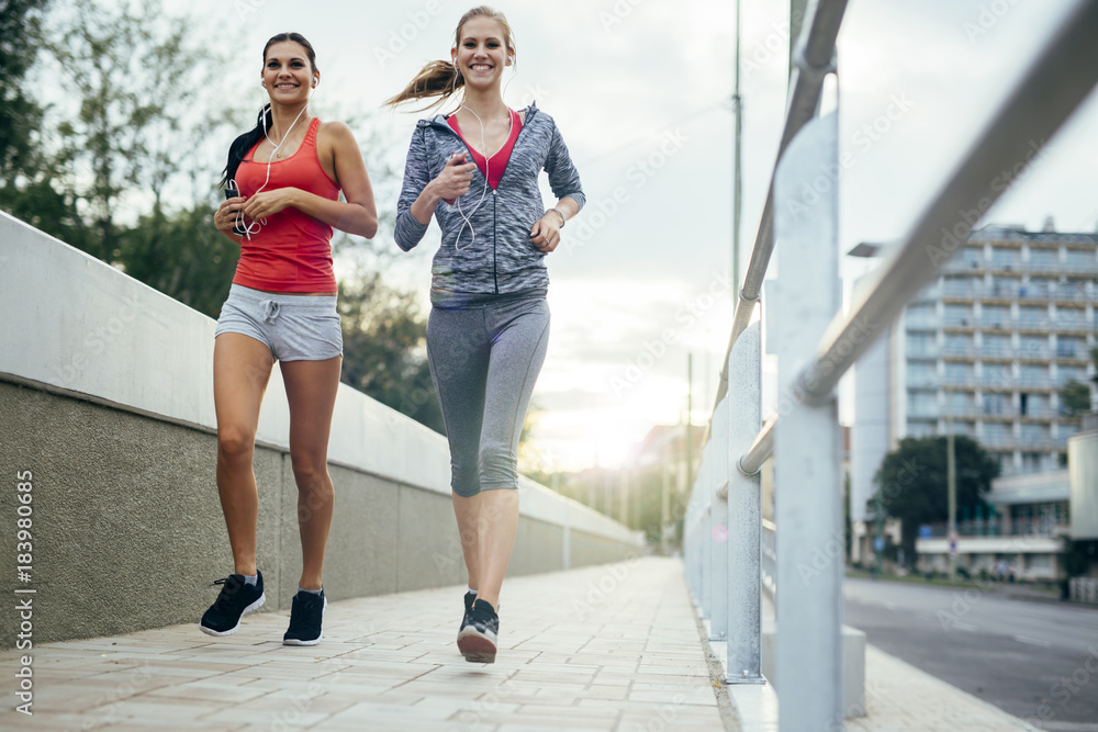 Obraz premium Active female joggers running outdoors
