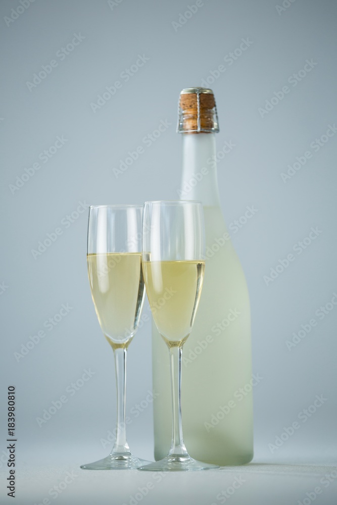 Glass of champagne with champagne bottle Glass of champagne with champagne bottle