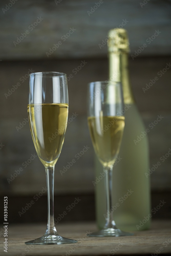 Glass of champagne with champagne bottle Glass of champagne with champagne bottle