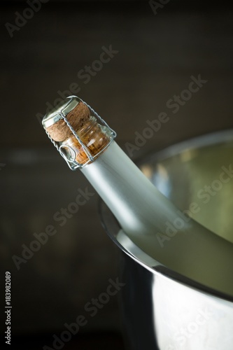Champagne bottle in a silver ice bucket