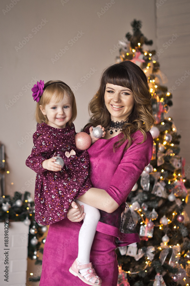 Happy embrace of mother and daughter against the background of the Ch Happy embrace of mother and daughter against the background of the Ch