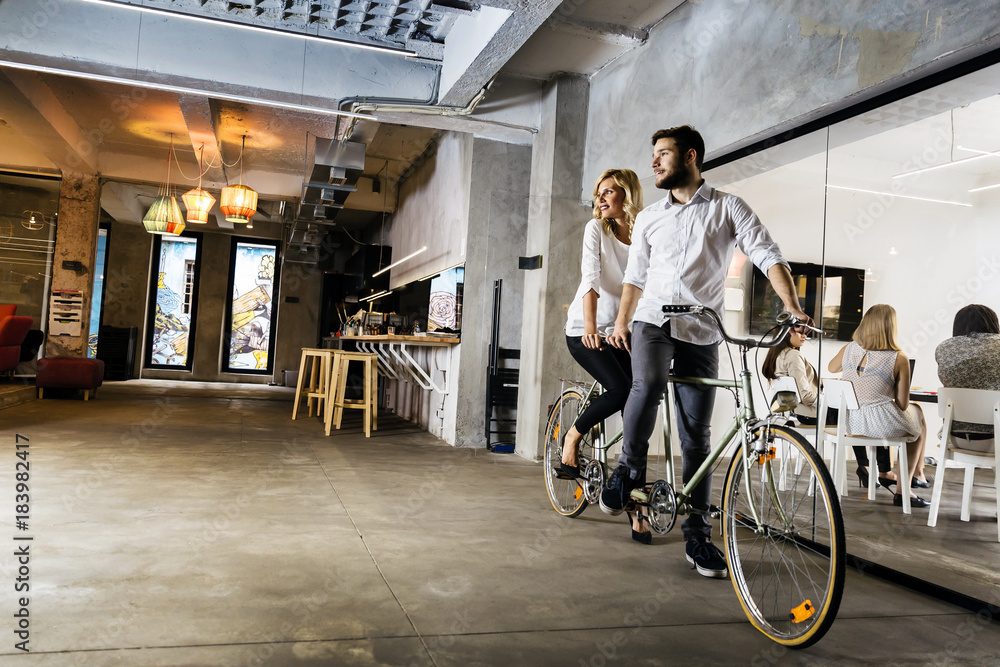 Business people on twin bicycle Business people on twin bicycle