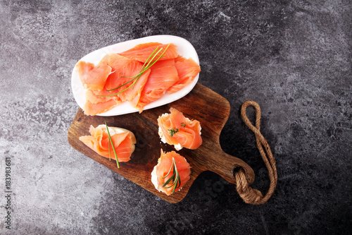Fotografie Bread with smoked salmon and cream cheese and herbs.