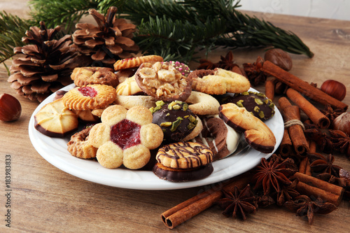 Plate with tasty fresh Christmas cookies on  table